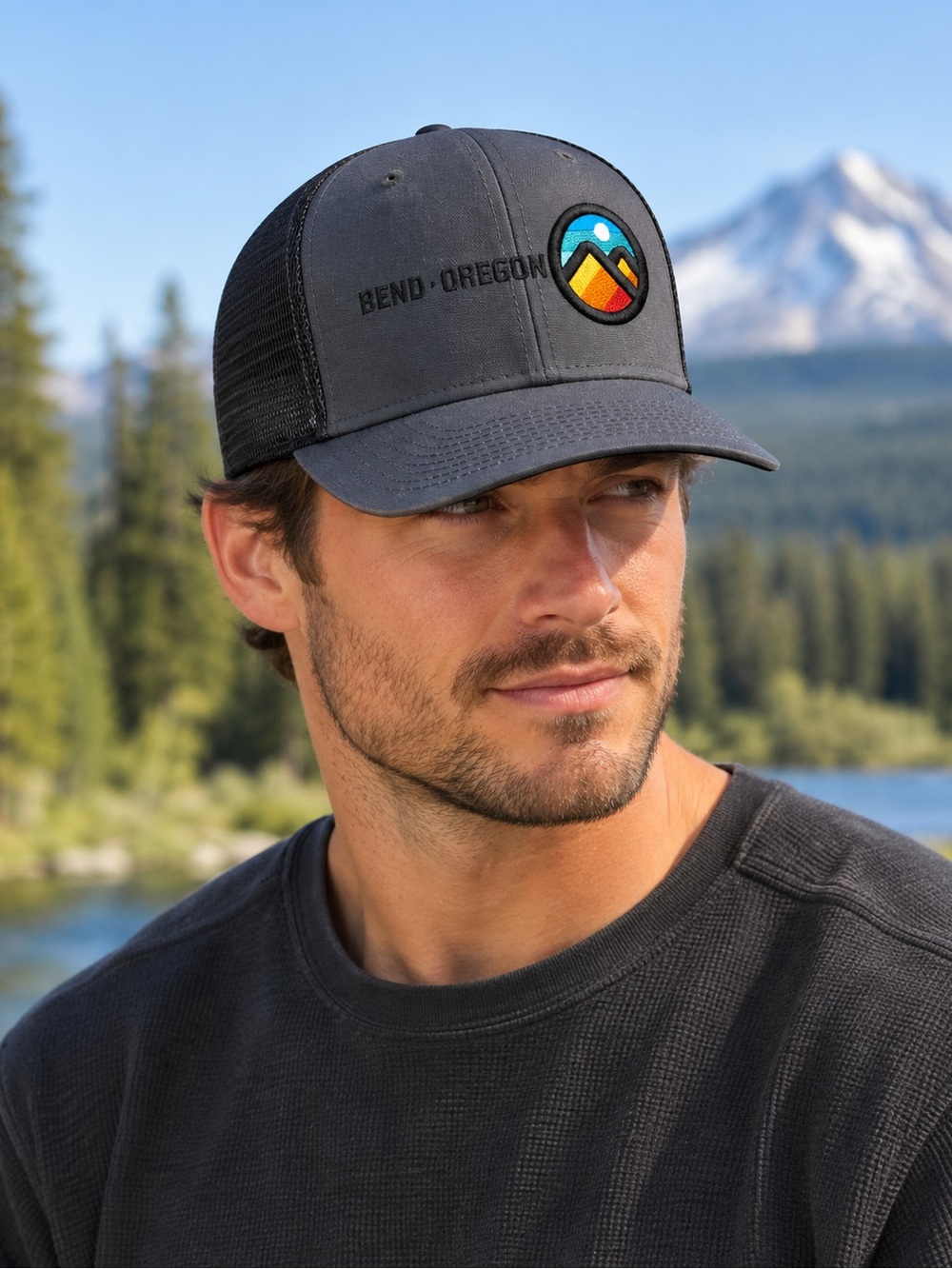 Ouray Sportswear Bend Oregon Dark Gray Trucker Cap with Color Mountain Patch